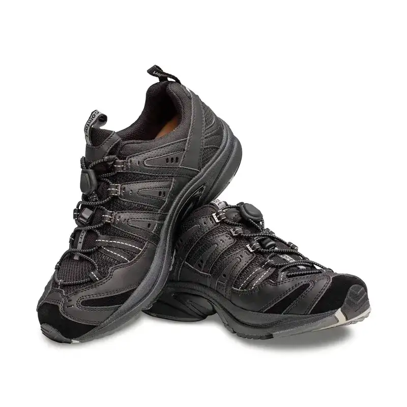 A pair of the Dr. Comfort Performance in black, angled to show the toggle lace and the reinforced toe