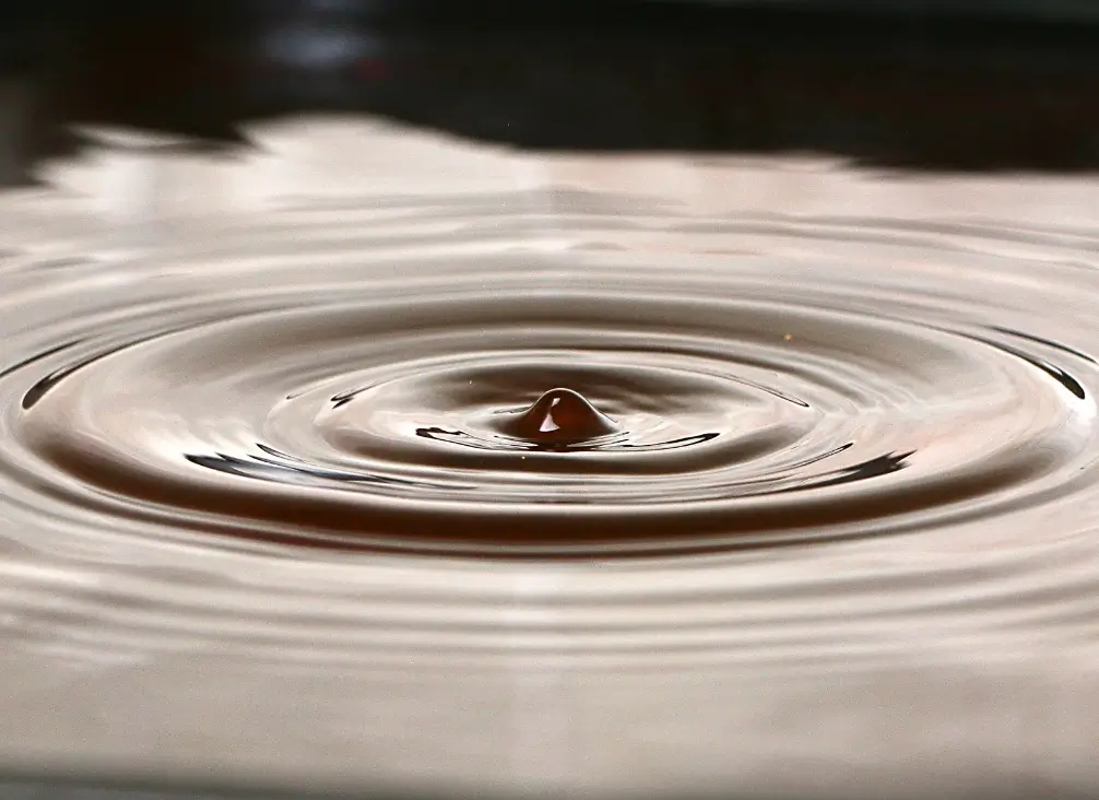 Shockwave ripple in liquid – symbolic of shockwave therapy used in podiatry Brunswick.