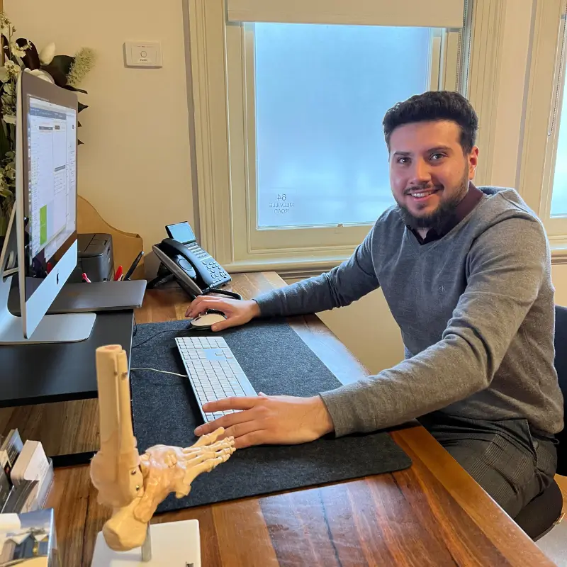 Brunswick podiatrist Dr Husein Al Zurifi at his clinic desk