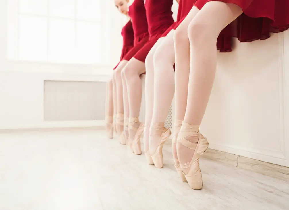 Young ballet dancers en pointe highlighting heel strain from tiptoe walking